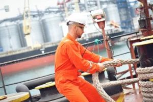 depositphotos_327299710-stock-photo-experienced-sailor-orange-overalls-white